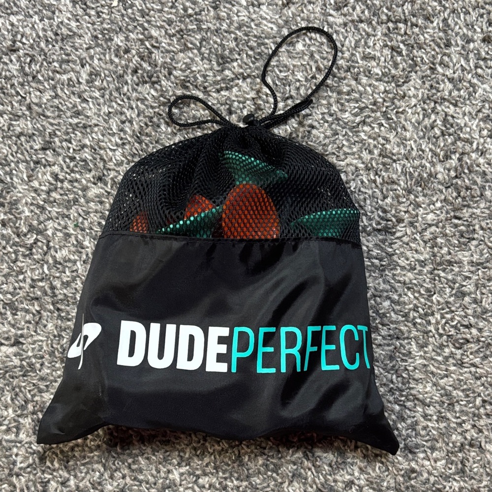 Dude Perfect Black Drawstring Bag with suction cup toys